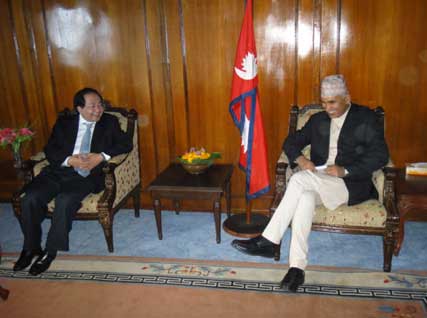 Nepali Minister of Defense Bishnu Prasad Paudel (right) receives the delegation at the Department of Defense. 