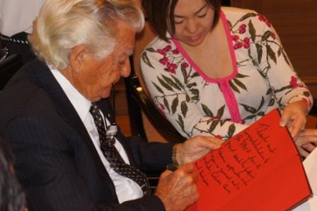 Mr. Hawke chats with a guest